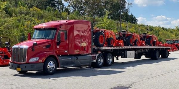 Flatbed semi truck carrying steel cargo