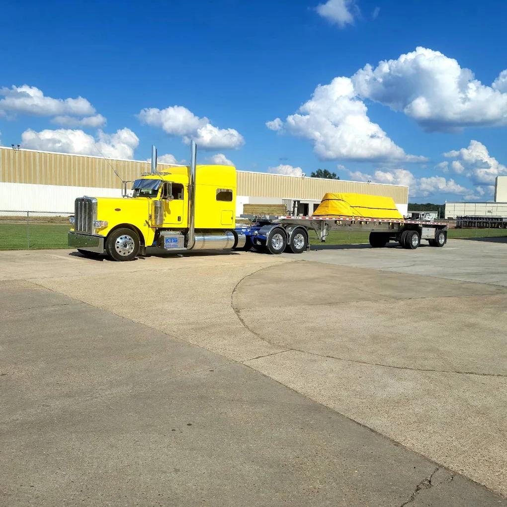 King Transportation yellow Peterbilt flatbed truck